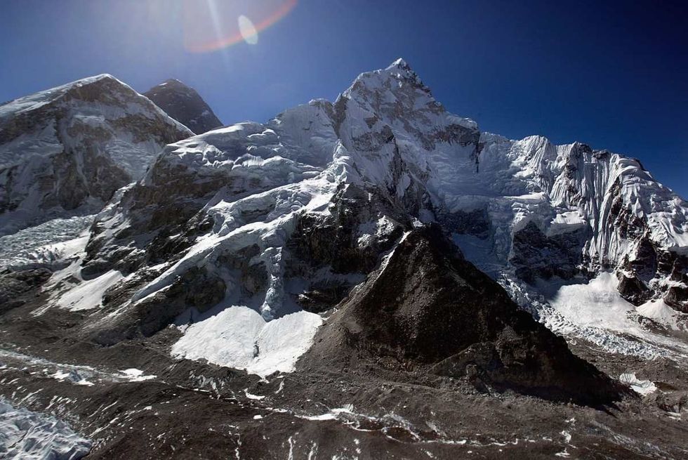 Image Source: 8,850-meter (29,035-foot) summit of Mount Everest, the World's tallest mountain May 29, 2003. (Photo by Paula Bronstein/Getty Images)